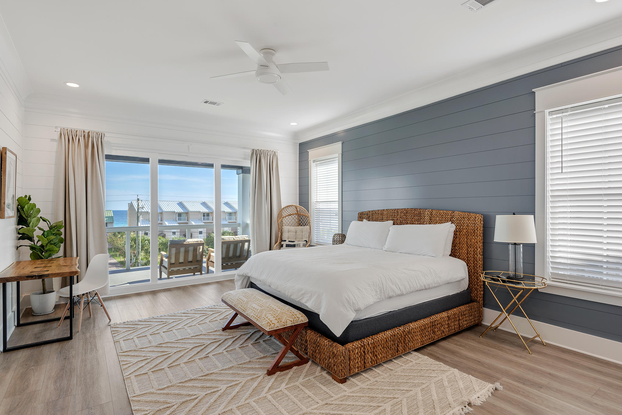 8427 East County Highway Seacrest, FL 32461 - Photo 58 of 74 a bedroom with a large bed and a large window