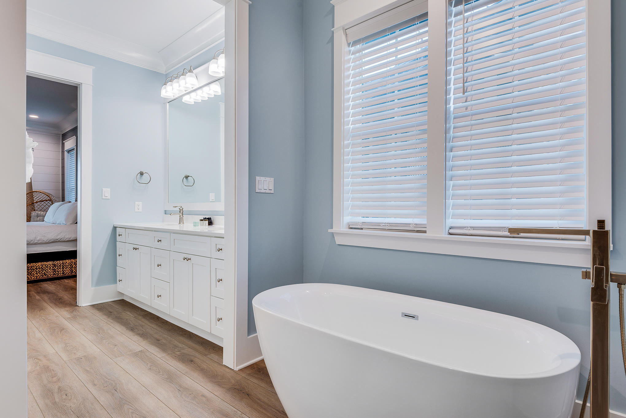 8427 East County Highway Seacrest, FL 32461 - Photo 60 of 74 a bathroom with a white tub sitting next to a white sink