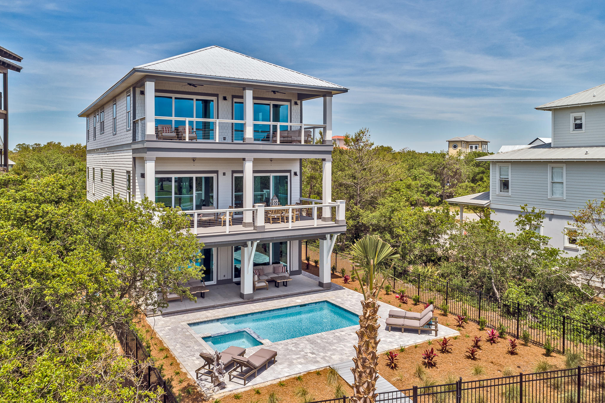 8427 East County Highway Seacrest, FL 32461 - Photo 65 of 74 a front view of a house with garden