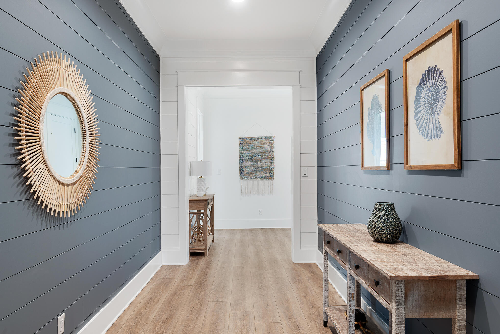 8427 East County Highway Seacrest, FL 32461 - Photo 10 of 74 a view of a hallway with entryway wooden floor and front door