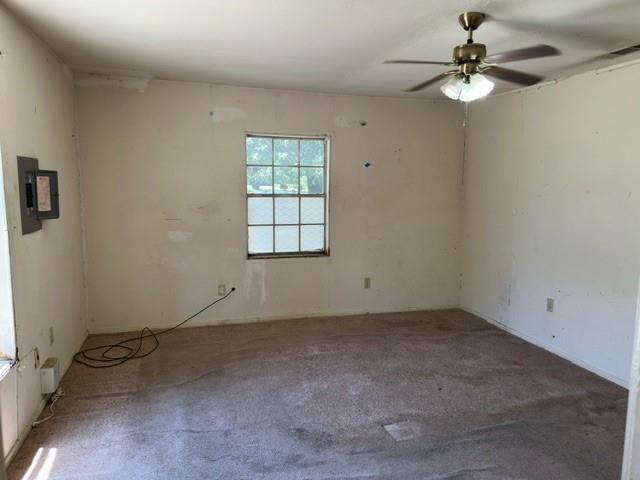 611 South Ruddell Street Denton, TX 76205 - Photo 11 of 18 an empty room with windows and fan