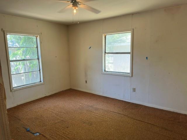 611 South Ruddell Street Denton, TX 76205 - Photo 12 of 18 an empty room with a window