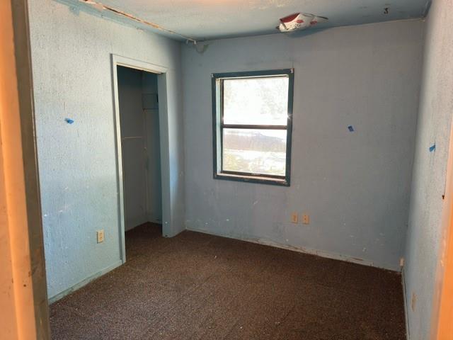 611 South Ruddell Street Denton, TX 76205 - Photo 4 of 18 an empty room with windows
