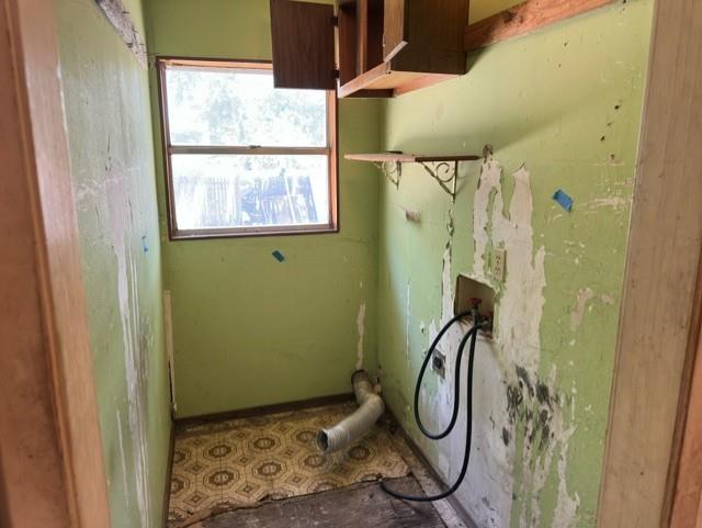 611 South Ruddell Street Denton, TX 76205 - Photo 7 of 18 a bathroom with a granite countertop shower and a window