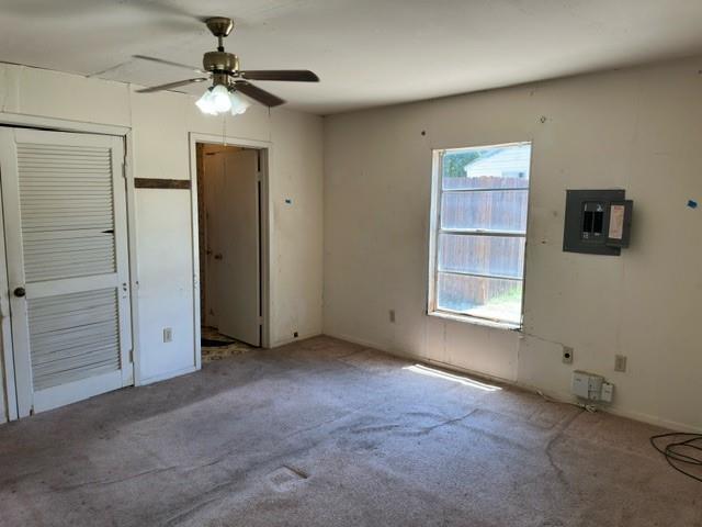 611 South Ruddell Street Denton, TX 76205 - Photo 8 of 18 an empty room with windows and fan
