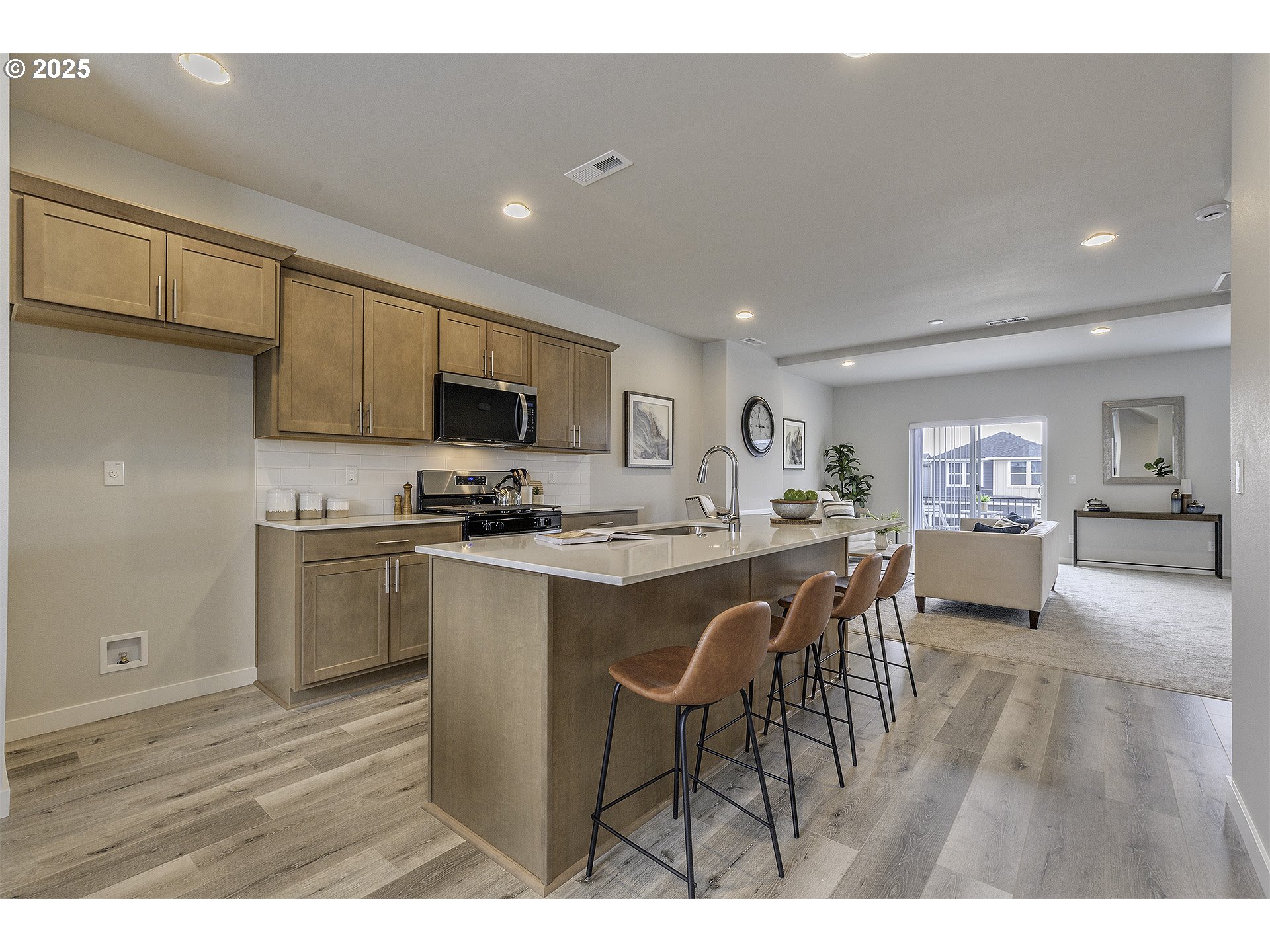 2129 Colby Lane, Unit 75 Forest Grove, OR 97116 - Photo 16 of 33 a open kitchen with stainless steel appliances granite countertop a stove a sink a refrigerator and a microwave