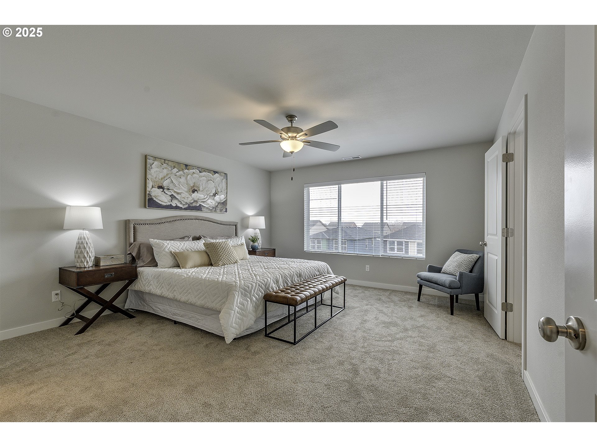 2129 Colby Lane, Unit 75 Forest Grove, OR 97116 - Photo 25 of 33 a spacious bedroom with a bed a couch and a large window