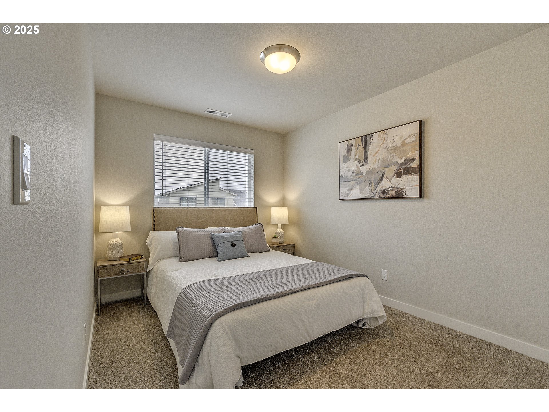2129 Colby Lane, Unit 75 Forest Grove, OR 97116 - Photo 29 of 33 a bedroom with a bed and a painting on the wall
