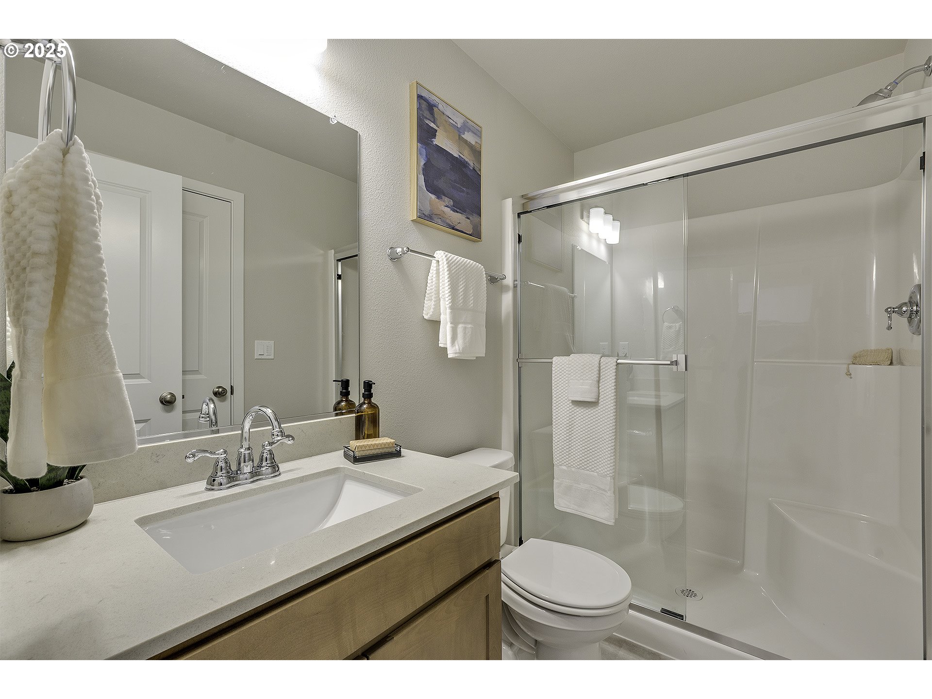 2129 Colby Lane, Unit 75 Forest Grove, OR 97116 - Photo 7 of 33 a bathroom with a sink toilet a mirror and shower