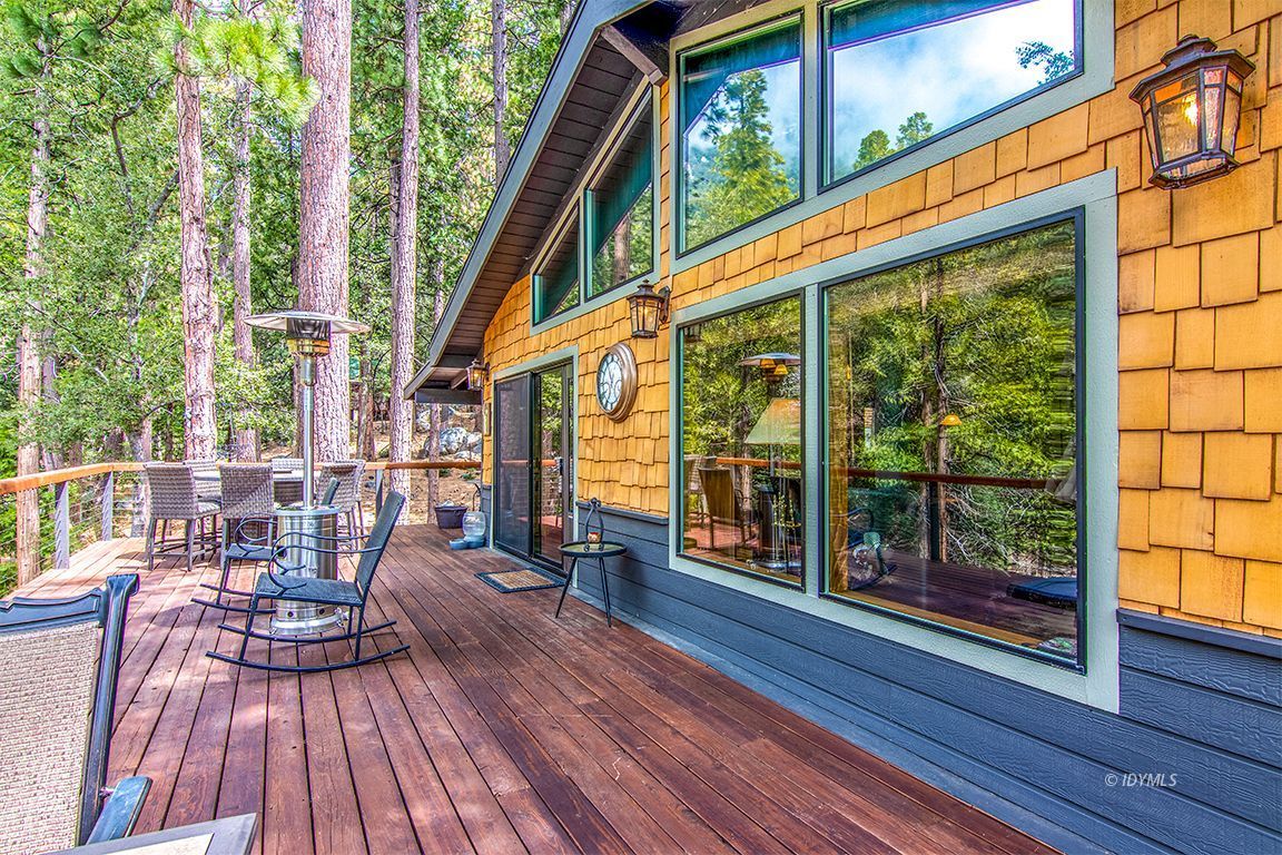 24750 Upper Rim Rock Road Idyllwild, CA 92549 - Photo 38 of 58 a view of balcony with chairs and wooden floor