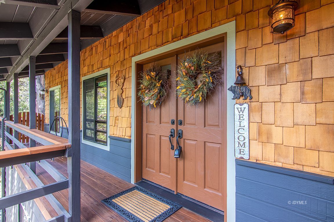 24750 Upper Rim Rock Road Idyllwild, CA 92549 - Photo 5 of 58 a view of front door with wooden floor