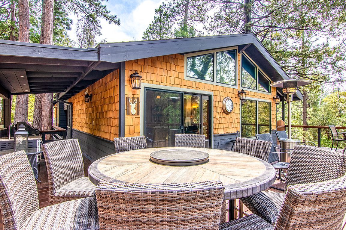 24750 Upper Rim Rock Road Idyllwild, CA 92549 - Photo 42 of 58 a view of a patio with couches chairs and a table