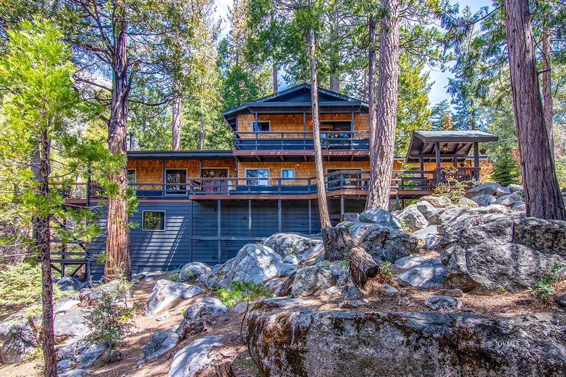 24750 Upper Rim Rock Road Idyllwild, CA 92549 - Photo 53 of 58 a front view of a house with a yard