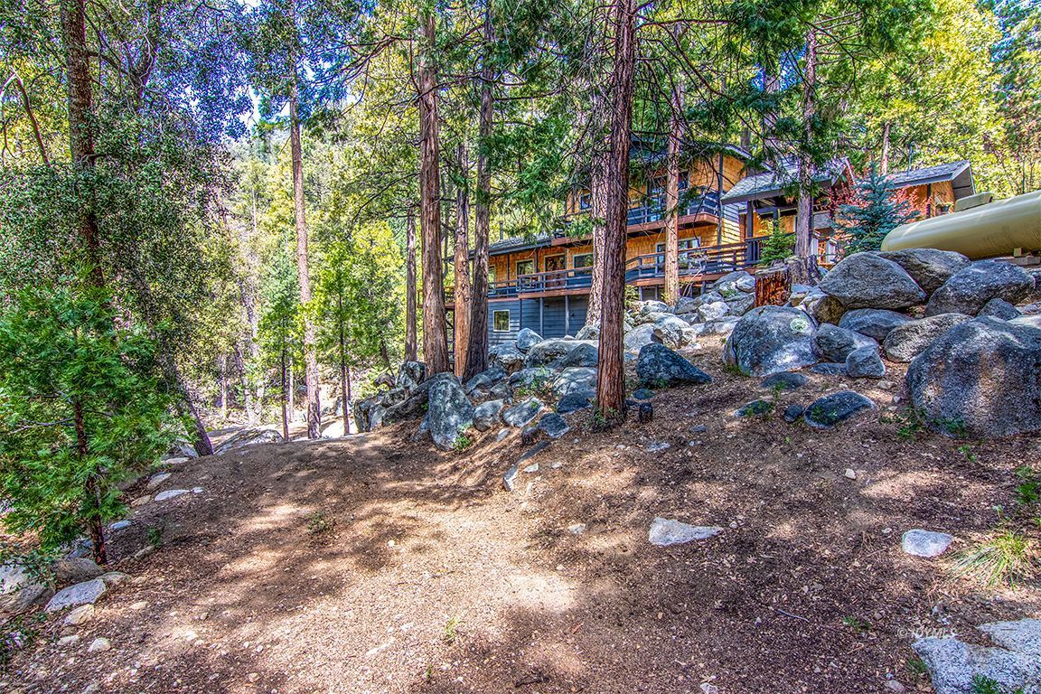 24750 Upper Rim Rock Road Idyllwild, CA 92549 - Photo 54 of 58 a backyard of a house with lots of green space