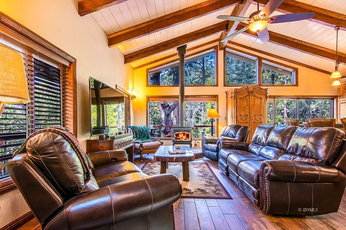24750 Upper Rim Rock Road Idyllwild, CA 92549 - Photo 8 of 58 a living room with furniture and a large window