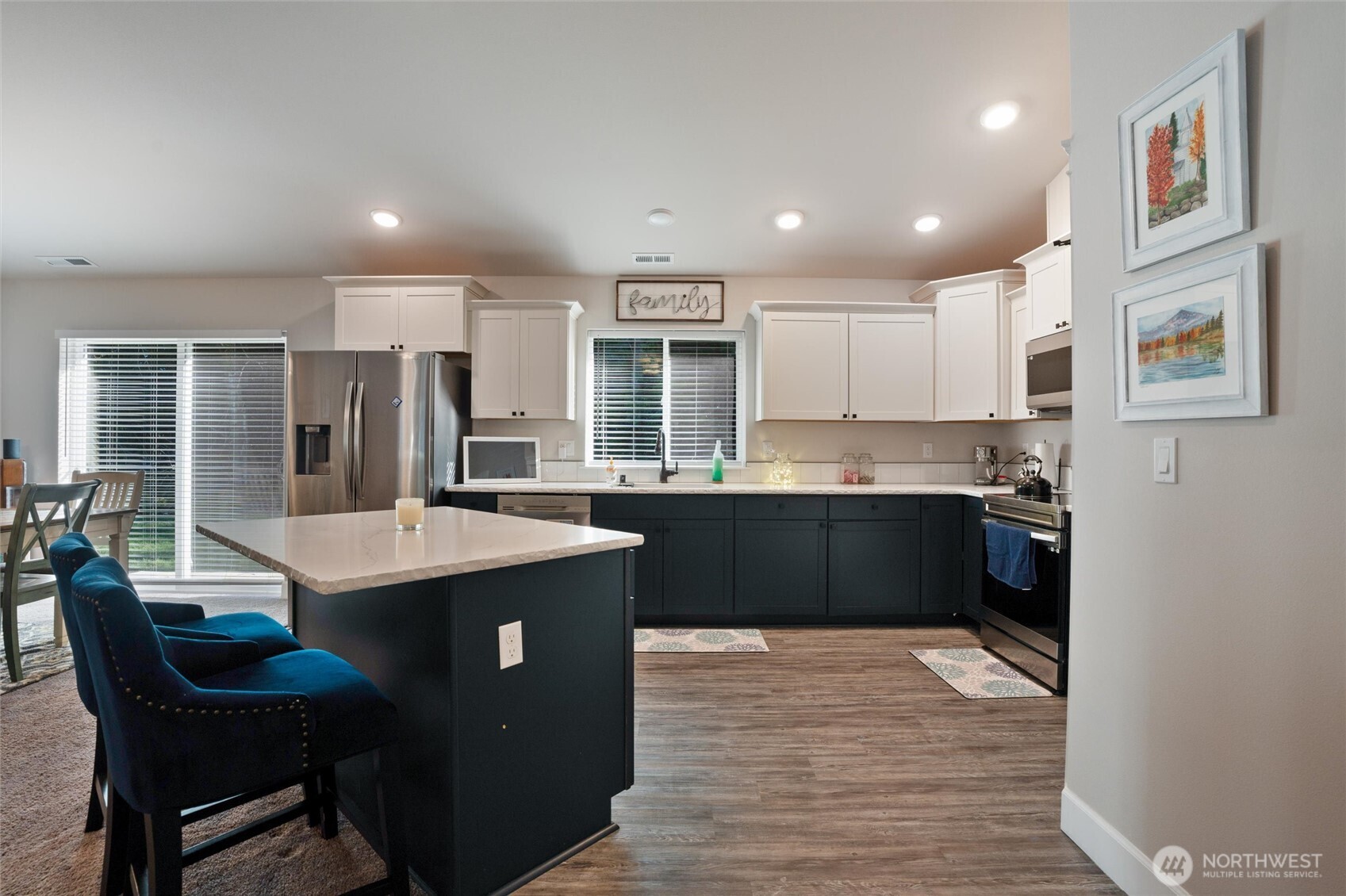 21356 Jefferson Beach Road Northeast Kingston, WA 98346 - Photo 14 of 40 a kitchen with granite countertop a sink and cabinets