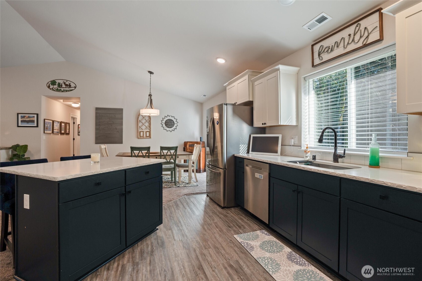21356 Jefferson Beach Road Northeast Kingston, WA 98346 - Photo 16 of 40 a kitchen with a sink stove and cabinets