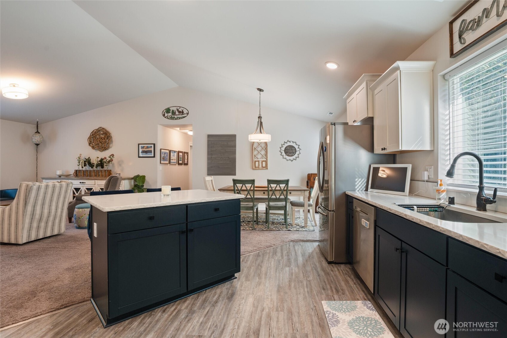21356 Jefferson Beach Road Northeast Kingston, WA 98346 - Photo 17 of 40 a kitchen with counter top space sink stove and wooden floor