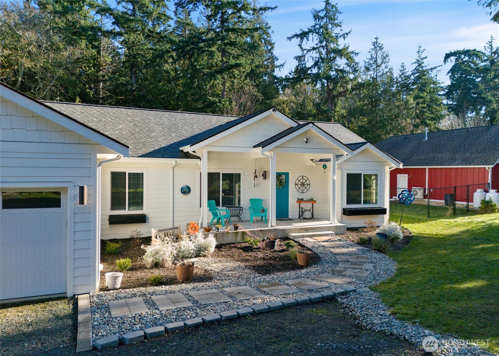 21356 Jefferson Beach Road Northeast Kingston, WA 98346 - Photo 2 of 40 a front view of house with yard outdoor seating and green space