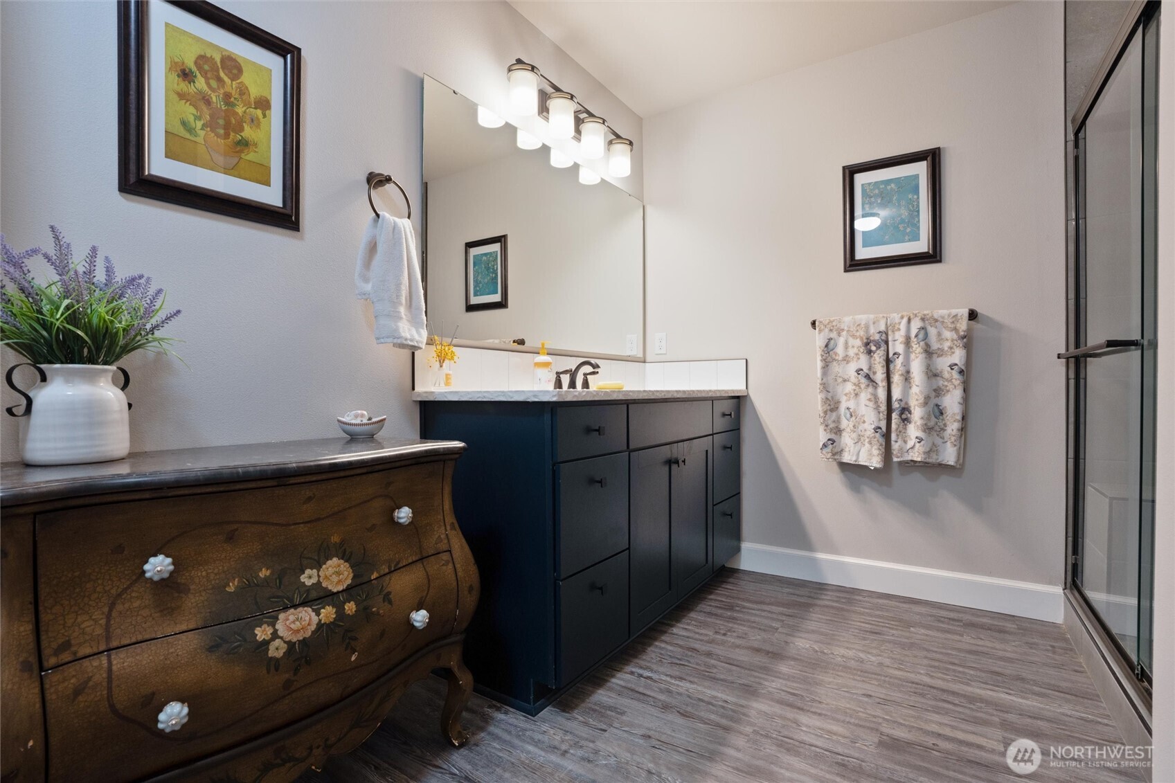 21356 Jefferson Beach Road Northeast Kingston, WA 98346 - Photo 22 of 40 a view of kitchen with stainless steel appliances granite countertop a sink a stove a dining table and chairs with wooden floor