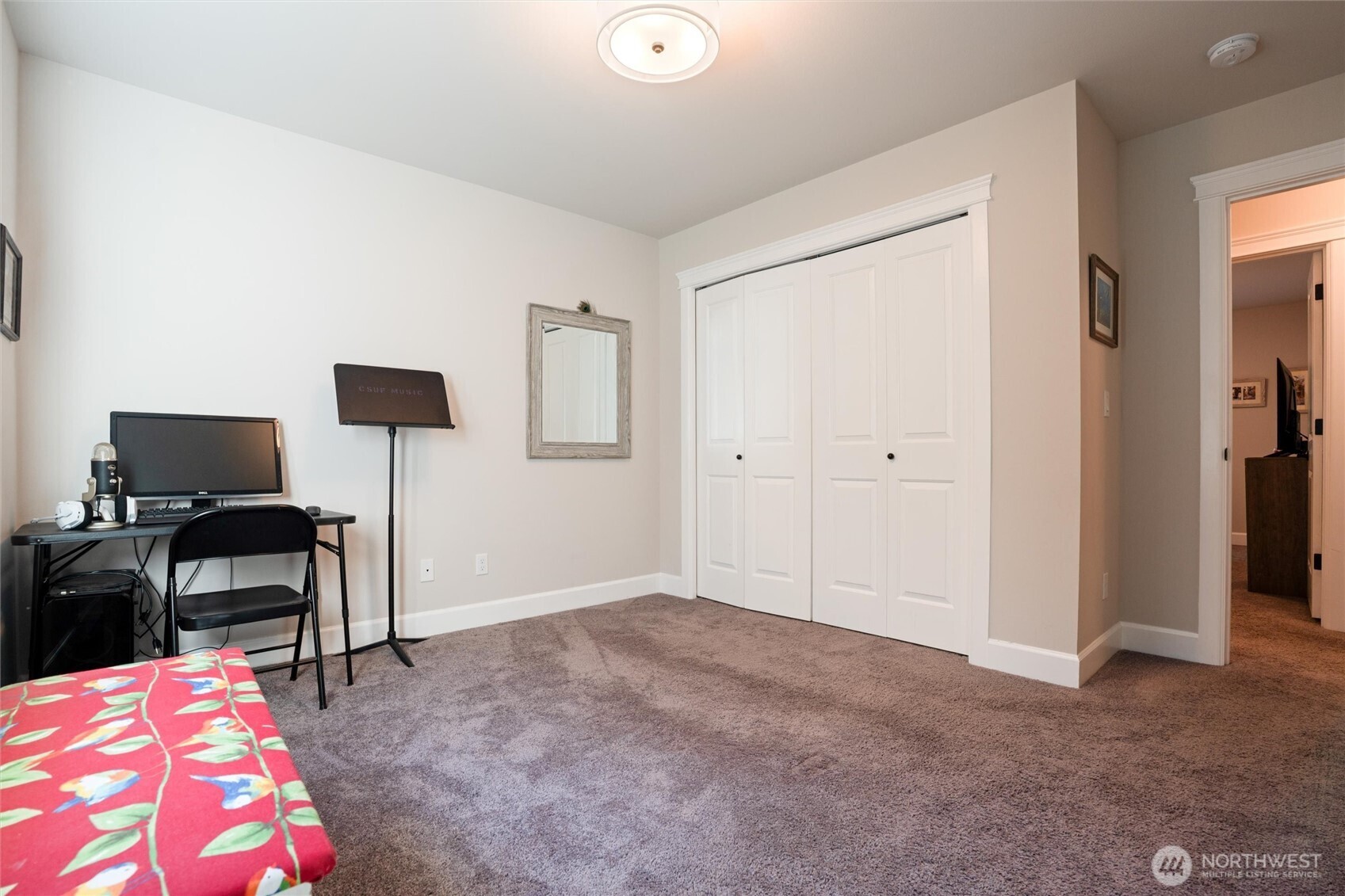 21356 Jefferson Beach Road Northeast Kingston, WA 98346 - Photo 25 of 40 a bedroom with a bed and a chair