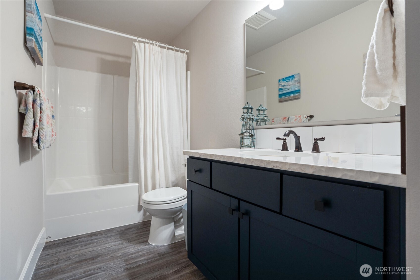 21356 Jefferson Beach Road Northeast Kingston, WA 98346 - Photo 26 of 40 a bathroom with a sink and a mirror