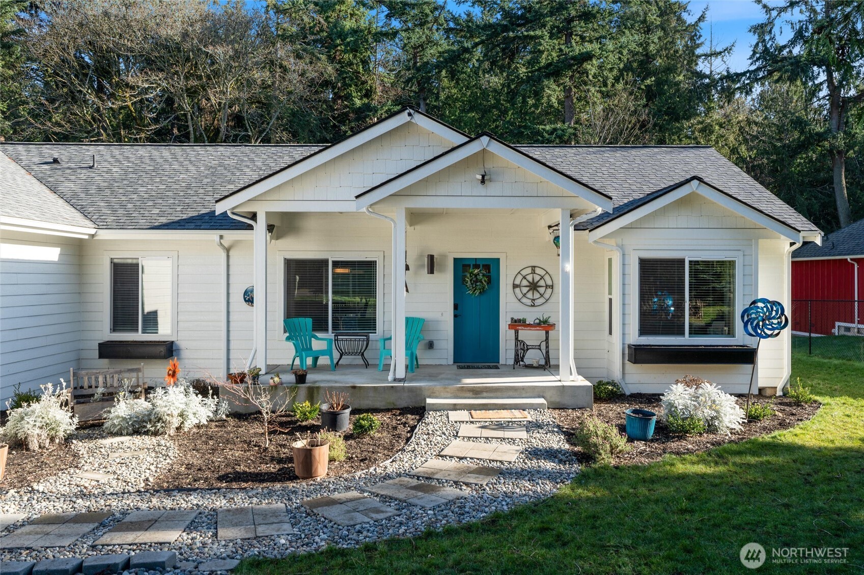 21356 Jefferson Beach Road Northeast Kingston, WA 98346 - Photo 3 of 40 a front view of house with yard outdoor seating and green space