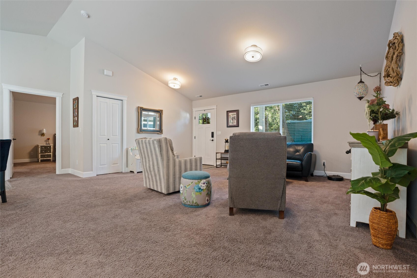 21356 Jefferson Beach Road Northeast Kingston, WA 98346 - Photo 7 of 40 a living room with furniture and a potted plant