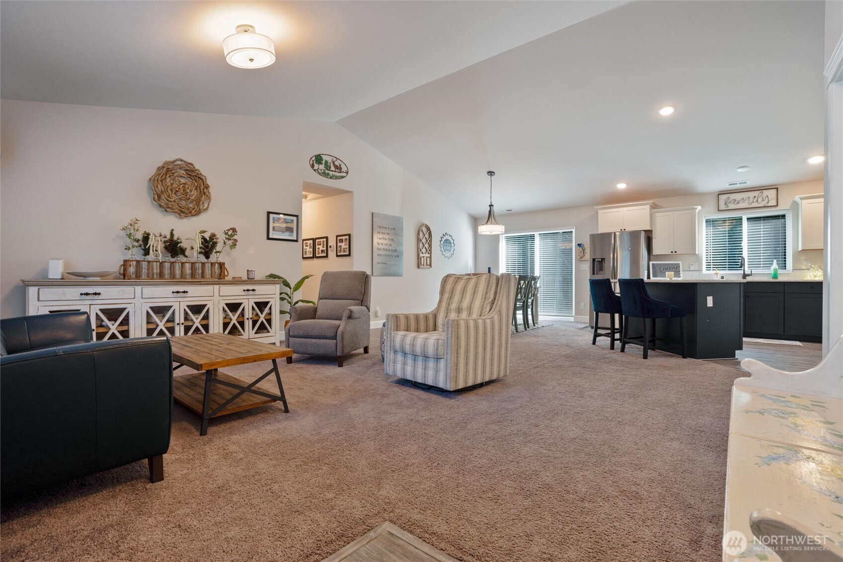 21356 Jefferson Beach Road Northeast Kingston, WA 98346 - Photo 8 of 40 a living room with furniture and kitchen view
