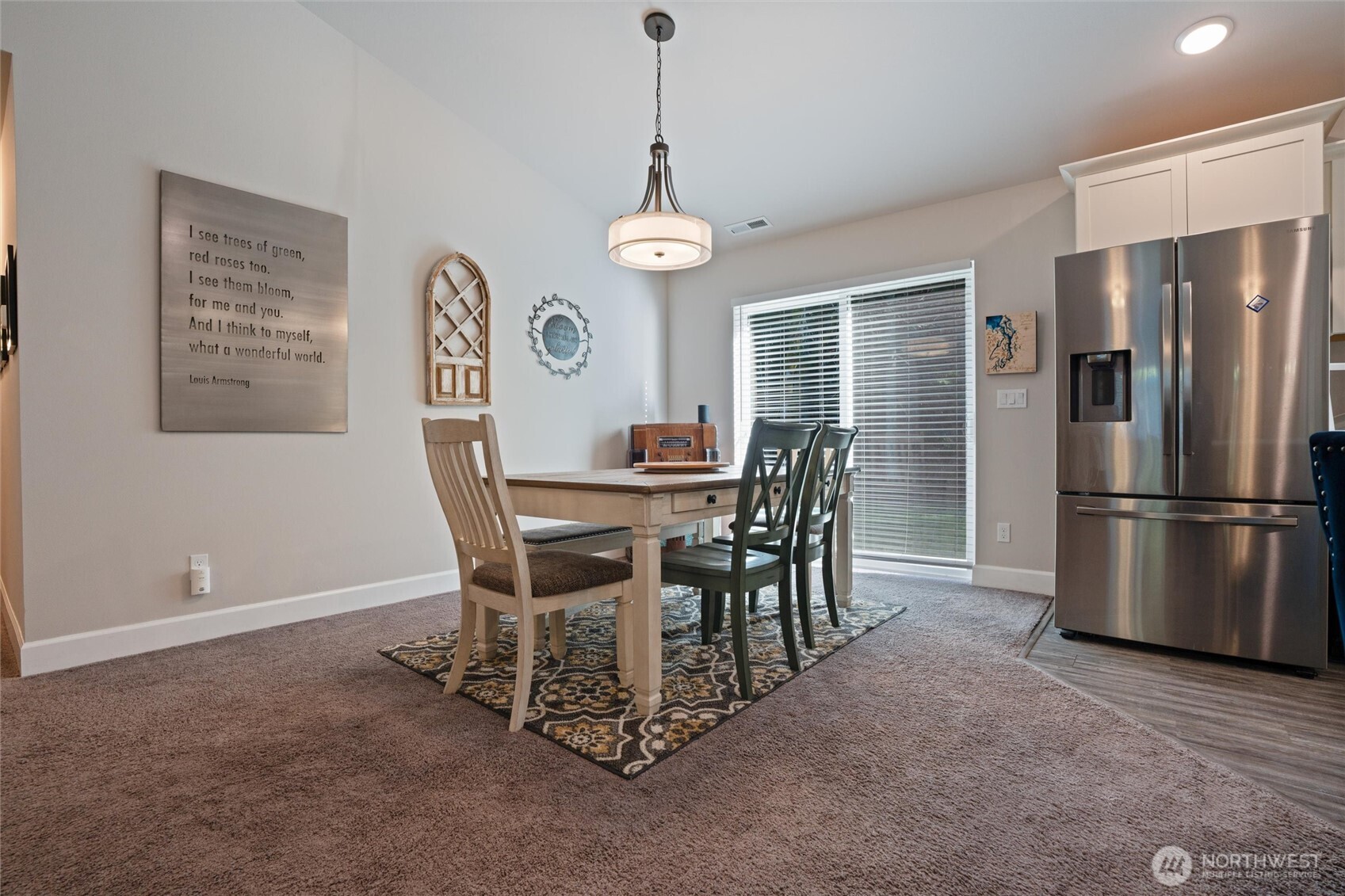 21356 Jefferson Beach Road Northeast Kingston, WA 98346 - Photo 10 of 40 a view of a dining room with furniture window and wooden floor