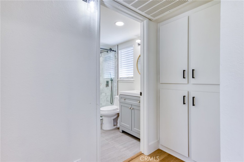 320 West Truslow Avenue, Unit D Fullerton, CA 92832 - Photo 12 of 25 a bathroom with a toilet sink and a mirror