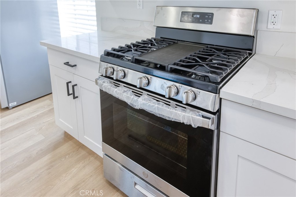 320 West Truslow Avenue, Unit D Fullerton, CA 92832 - Photo 14 of 25 a stove top oven sitting inside of a kitchen