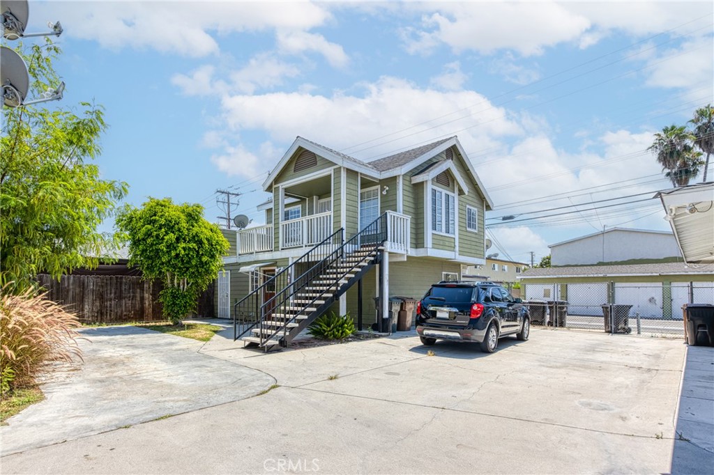 320 West Truslow Avenue, Unit D Fullerton, CA 92832 - Photo 5 of 25 a car parked in front of a building