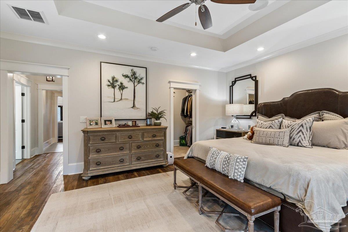 9050 Salter Road Pace, FL 32571 - Photo 20 of 48 a bedroom with a bed and ceiling fan