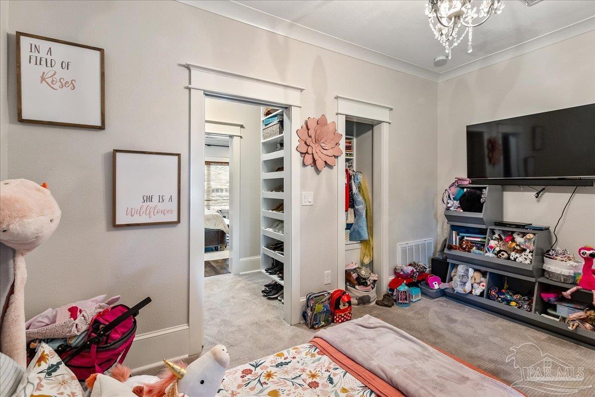 9050 Salter Road Pace, FL 32571 - Photo 26 of 48 a living room with furniture and a flat screen tv