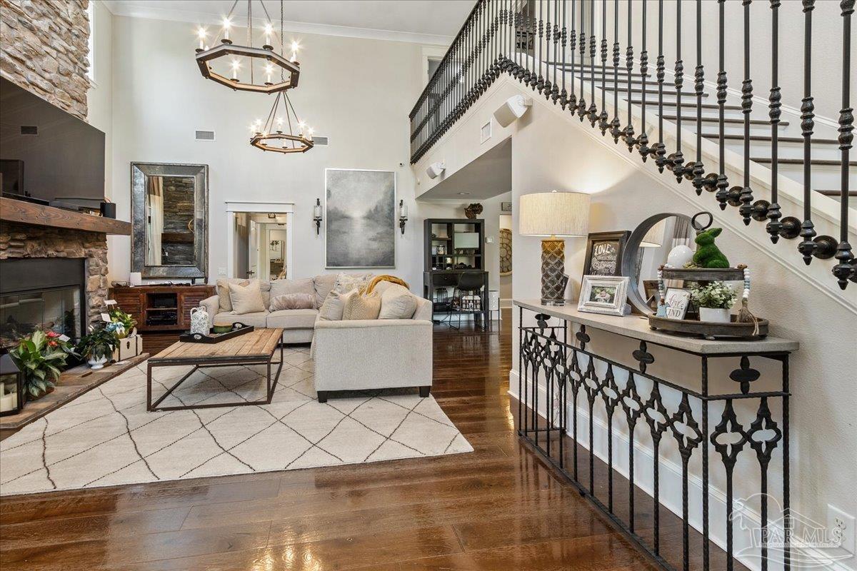 9050 Salter Road Pace, FL 32571 - Photo 3 of 48 a living room with furniture fireplace and flat screen tv