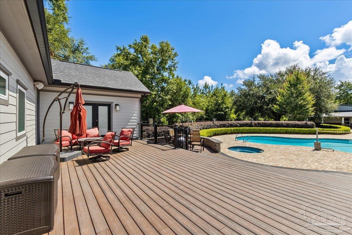 9050 Salter Road Pace, FL 32571 - Photo 34 of 48 a view of a house with swimming pool and sitting area