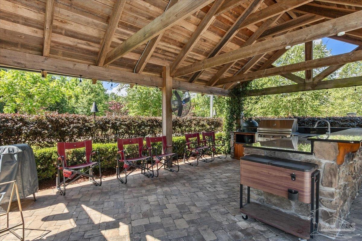 9050 Salter Road Pace, FL 32571 - Photo 37 of 48 a view of a chairs and table in the patio