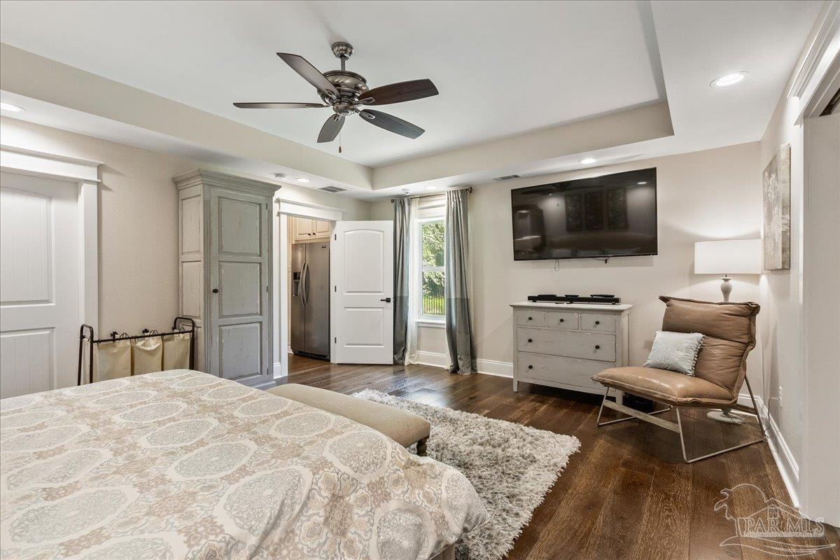 9050 Salter Road Pace, FL 32571 - Photo 45 of 48 a bedroom with a bed and a flat screen tv