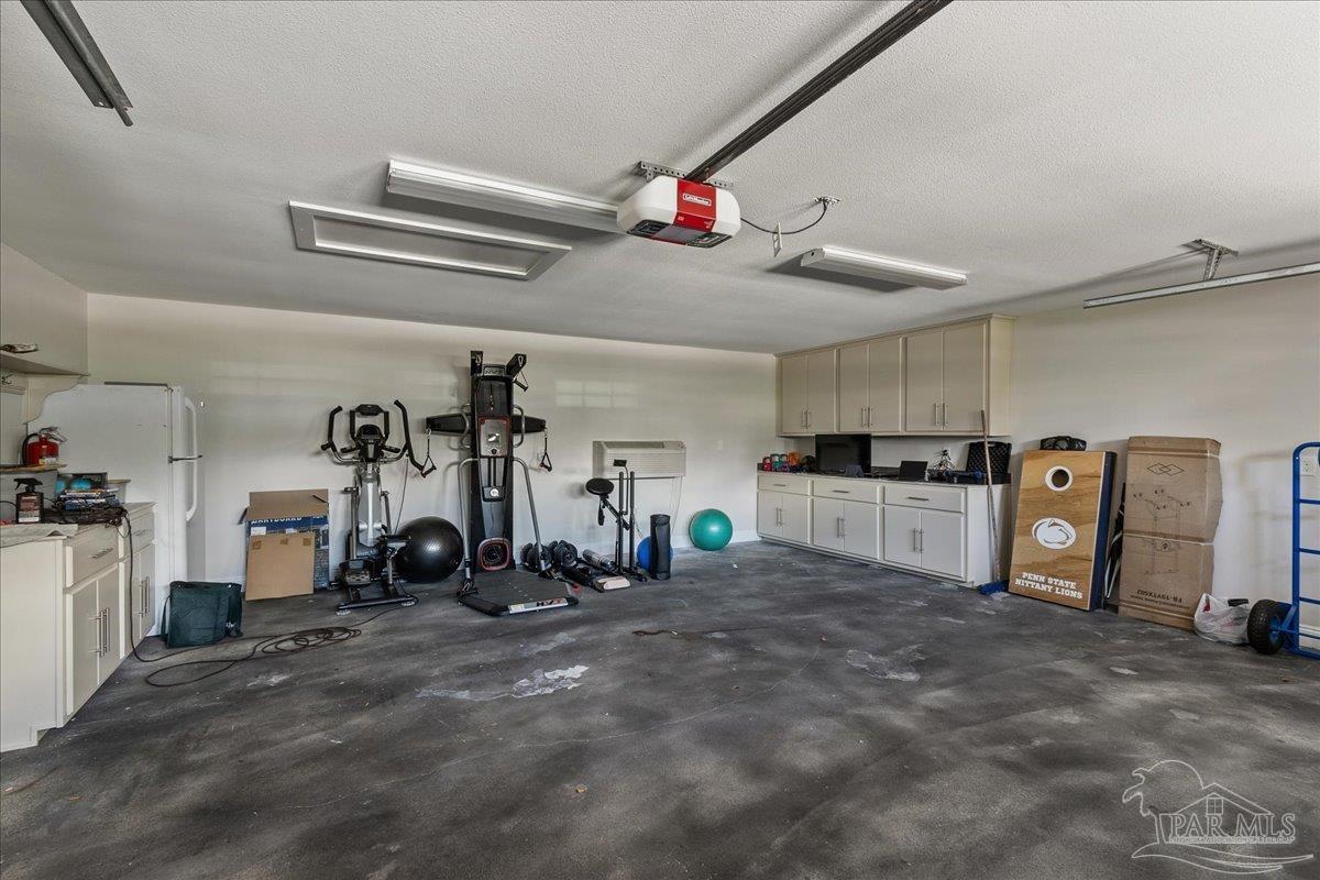 9050 Salter Road Pace, FL 32571 - Photo 48 of 48 a view of a room with gym equipment
