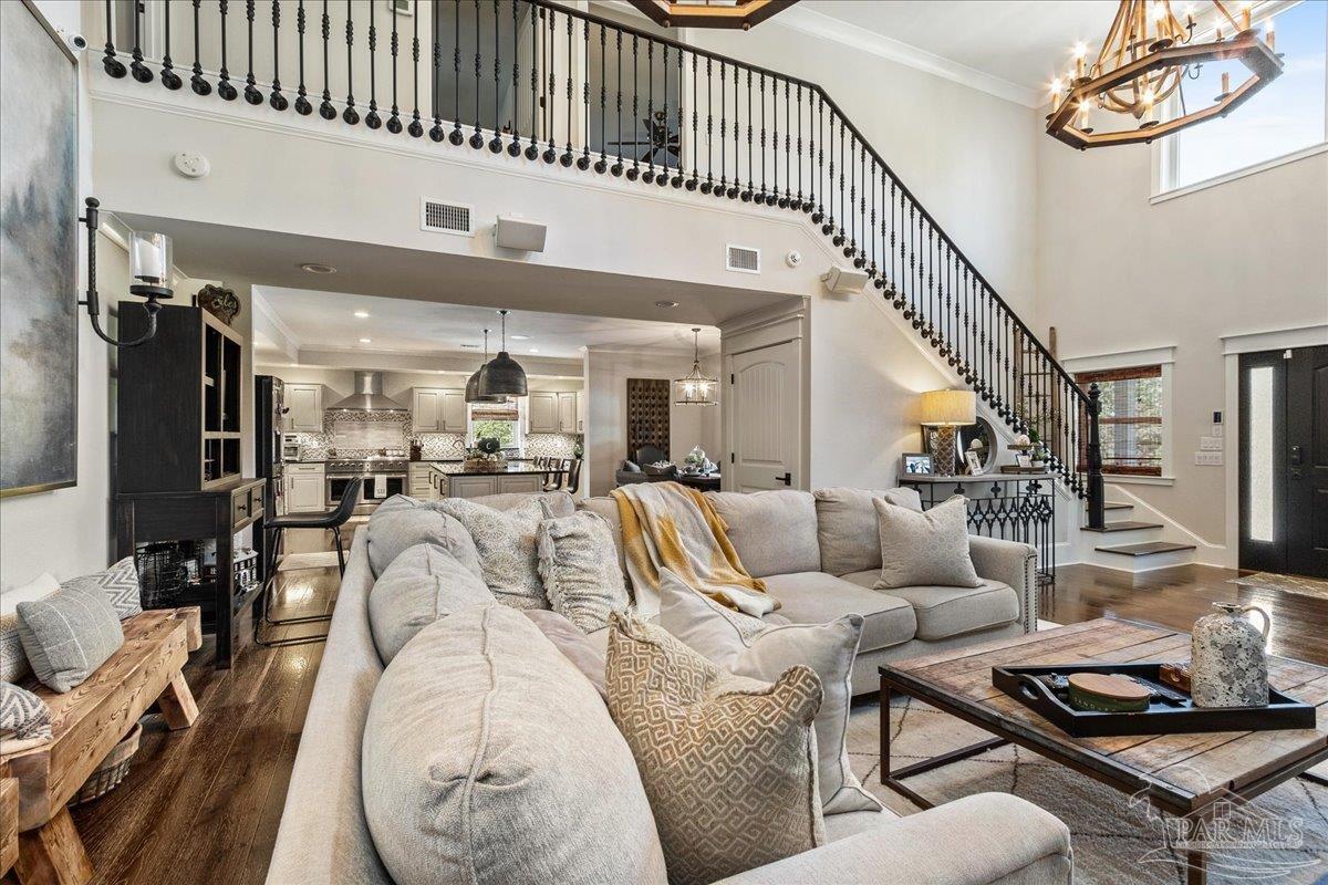 9050 Salter Road Pace, FL 32571 - Photo 6 of 48 a living room with furniture kitchen view and a wooden floor