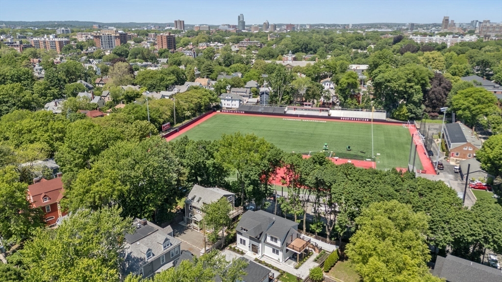 216 Aspinwall Avenue, Unit 3 Brookline, MA 02446 - Photo 31 of 38 an aerial view of a houses with a yard