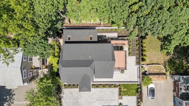 an aerial view of a house with outdoor space