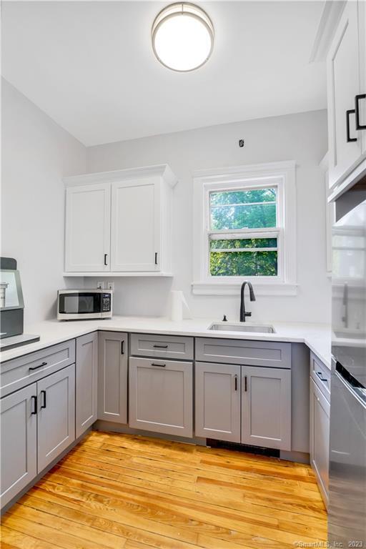 46 Washington Street Middletown, CT 06457 - Photo 3 of 8 a kitchen with a sink cabinets and window