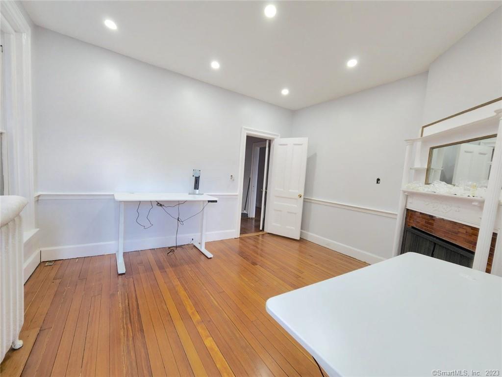 46 Washington Street Middletown, CT 06457 - Photo 6 of 8 a bedroom with a bed and a flat screen tv