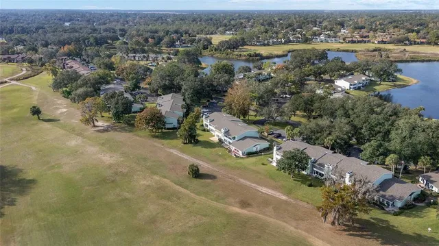 an aerial view of a house with a lake view
