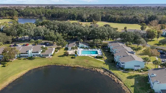 an aerial view of a house with a lake view