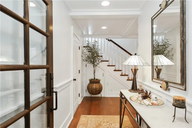 a living room with furniture and floor to ceiling window