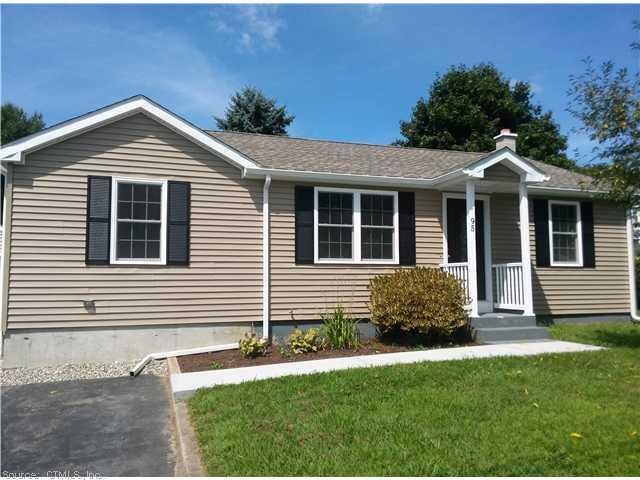 95 Daggett Street Plainfield, CT 06354 - Photo 1 of 1 a front view of a house with a yard