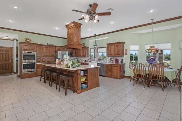 a living room with furniture and a book shelf